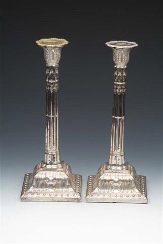 Appraisal: A PAIR OF SHEFFIELD PLATED TALL CANDLESTICKS each with loose