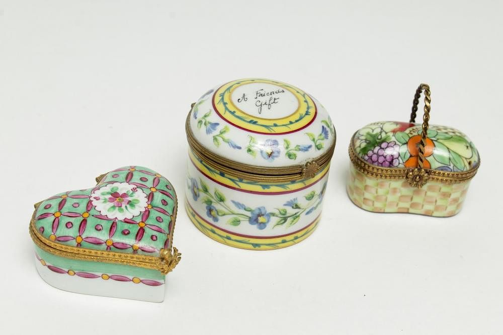 Appraisal: Tiffany Co Limoges Porcelain Pillboxes Limoges for Tiffany three ormolu-mounted