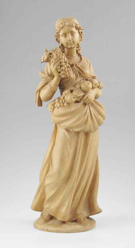 Appraisal: INTRICATELY CARVED WOODEN SCULPTURE OF A YOUNG MAIDEN CARRYING FRUIT