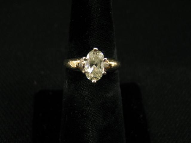 Appraisal: Diamond Ring carat oval diamond with three diamonds on each