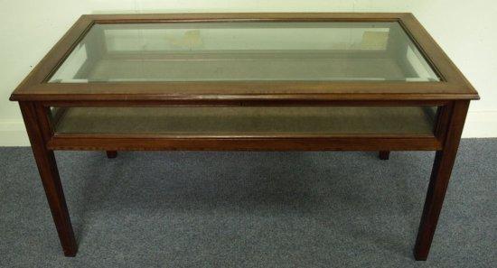 Appraisal: A mahogany display table with satinwood border having a bevelled