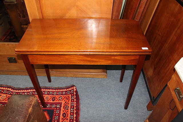 Appraisal: AN EARLY TH CENTURY MAHOGANY FOLDOVER TEA TABLE together with