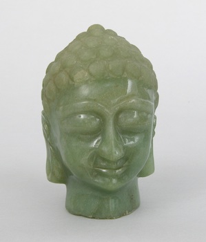 Appraisal: A Carved Jadeite Head of Buddha Chinese Carved jadeite head