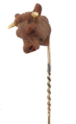 Appraisal: A gold stick pin mounted with a realistically carved bull's