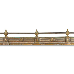 Appraisal: An Empire Style Brass and Steel Fire Fender with Recumbent