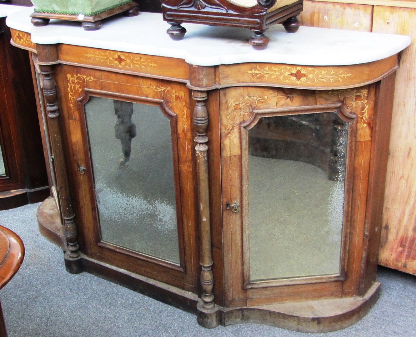 Appraisal: A Victorian credenza the shaped marble top over a marquetry