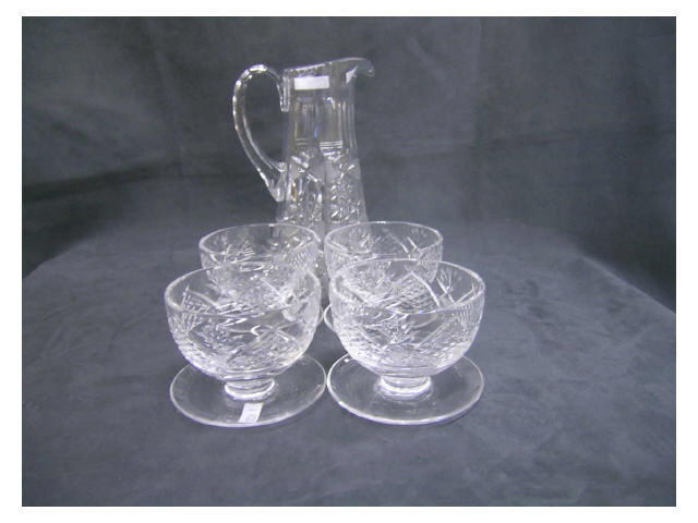 Appraisal: Vintage pattern glass lot including handled pitcher and four Waterford