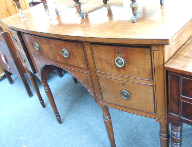 Appraisal: A Regency mahogany and ebony strung bowfront sideboard with drawers