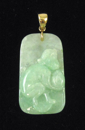 Appraisal: JADE AND FOURTEEN KARAT GOLD PENDANT The light green jade