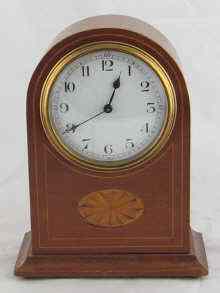 Appraisal: A mahogany cased mantel clock with Sheraton style inlay approx