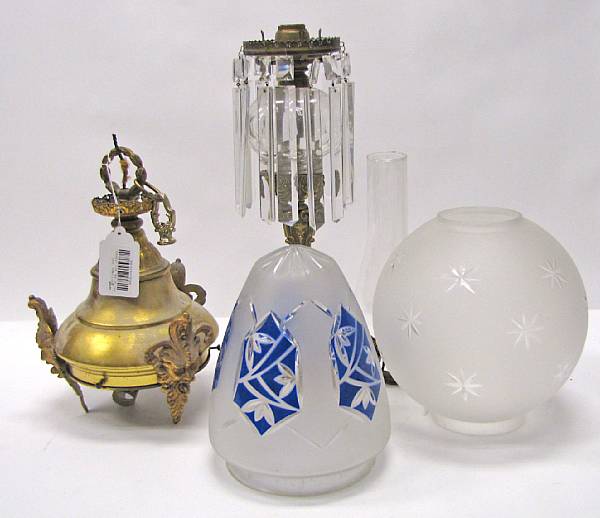 Appraisal: A Rococo Revival cast brass and cut glass oil lamp