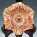 Appraisal: Carnival glass ruffled low bowl with radiating ribs on the