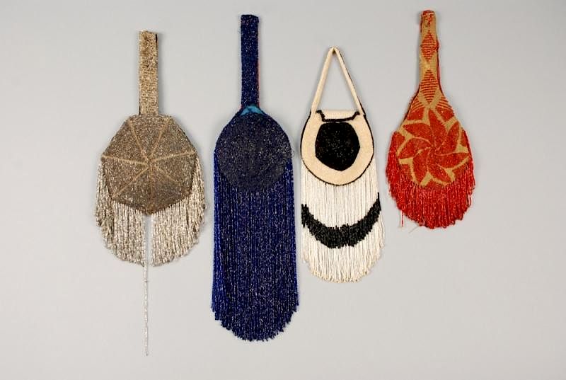 Appraisal: FOUR BEADED FLAPPER PURSES with FRINGE One blue with -inch