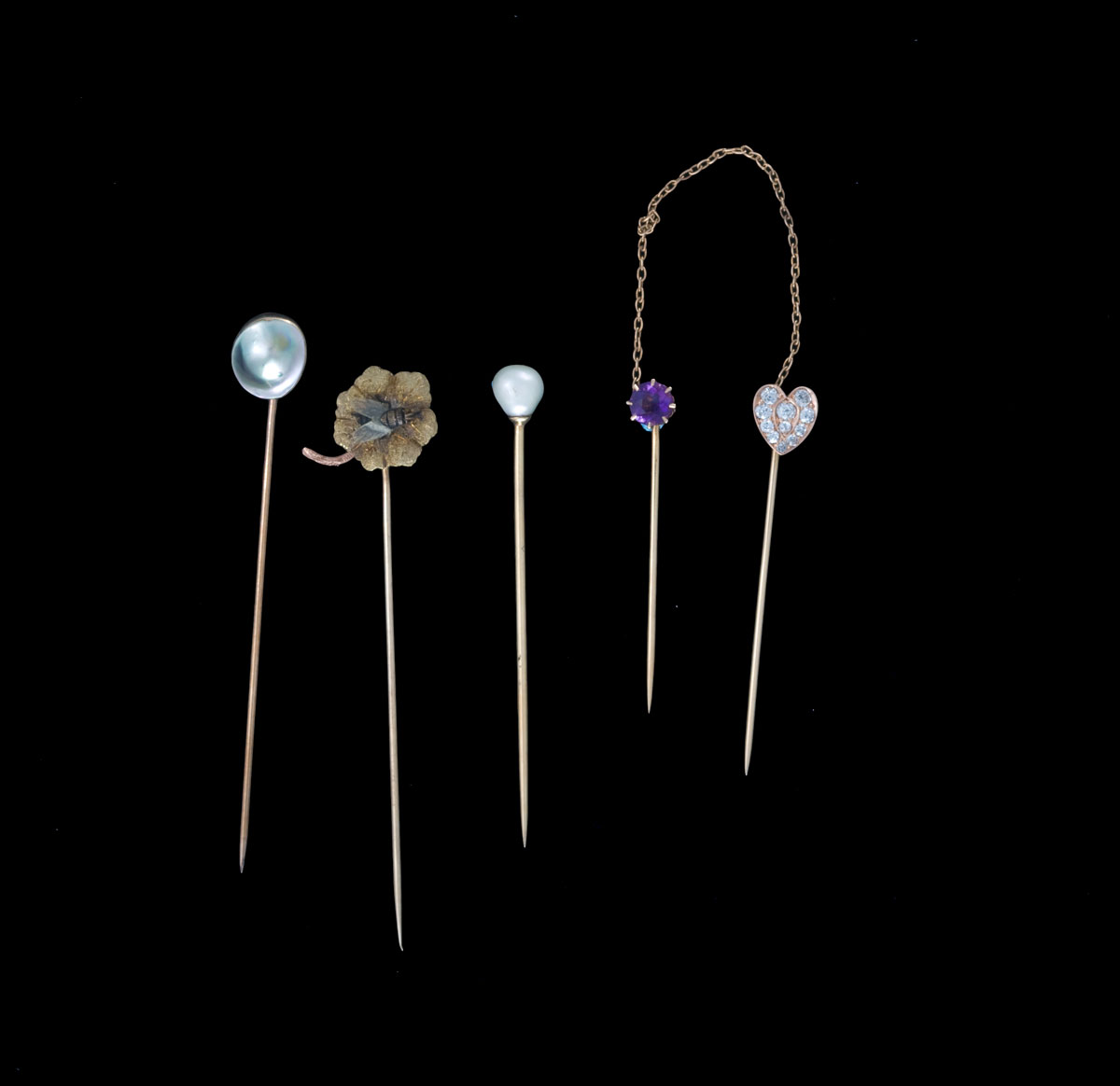 Appraisal: GROUP OF STICKPINS Comprising of a bezel set piece with