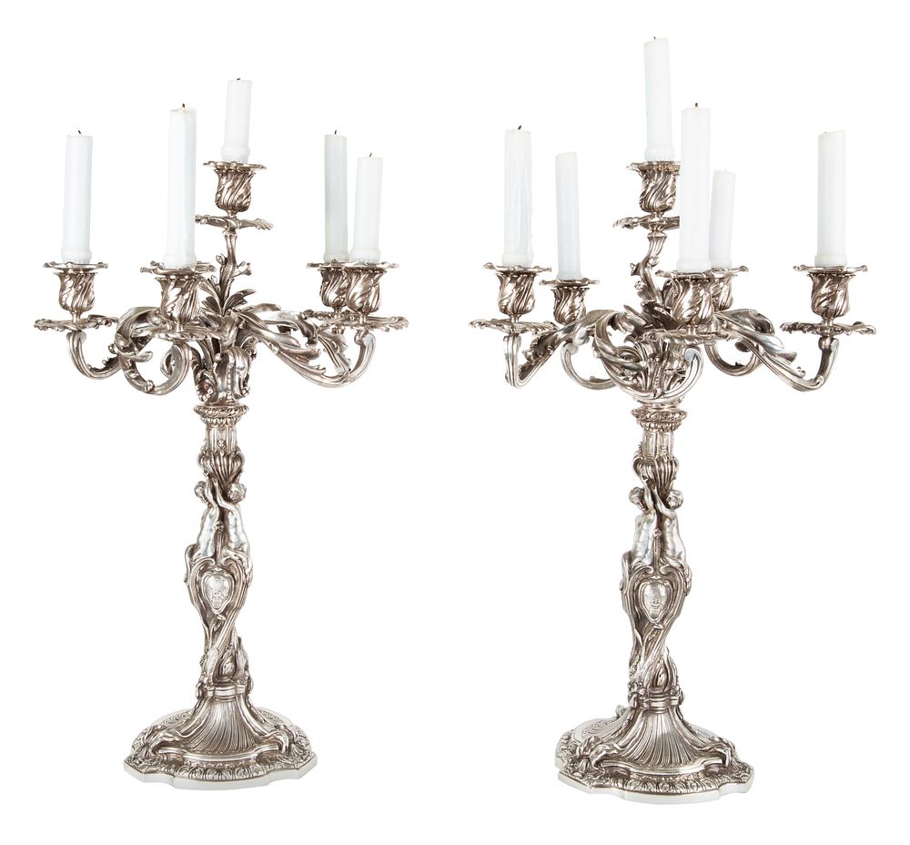 Appraisal: PAIR OF REGENCE-REVIVAL FIVE-ARMED SILVER-PATINATED CAST-BRONZE CANDELABRA MID- TH CENTURY