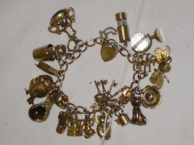 Appraisal: A CT ROSE GOLD CHARM BRACELET the curb links with