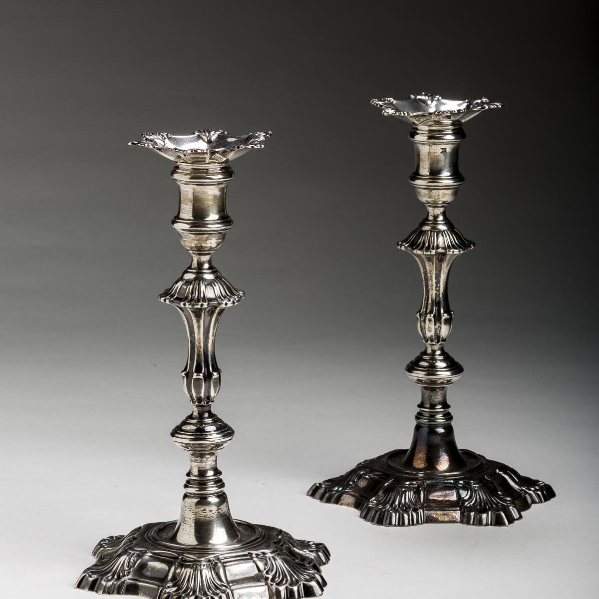 Appraisal: PAIR OF GEORGE II SILVER CRESTED TABLE CANDLESTICKS WILLIAM GOULD