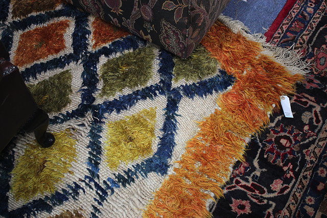 Appraisal: A MID TH CENTURY WOOLLEN RUG with a central diamond