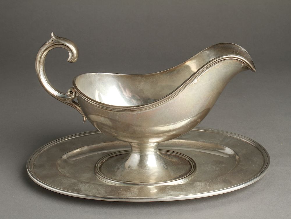 Appraisal: Portuguese Silver Sauceboat Underplate Set Portuguese silver gravy sauce boat