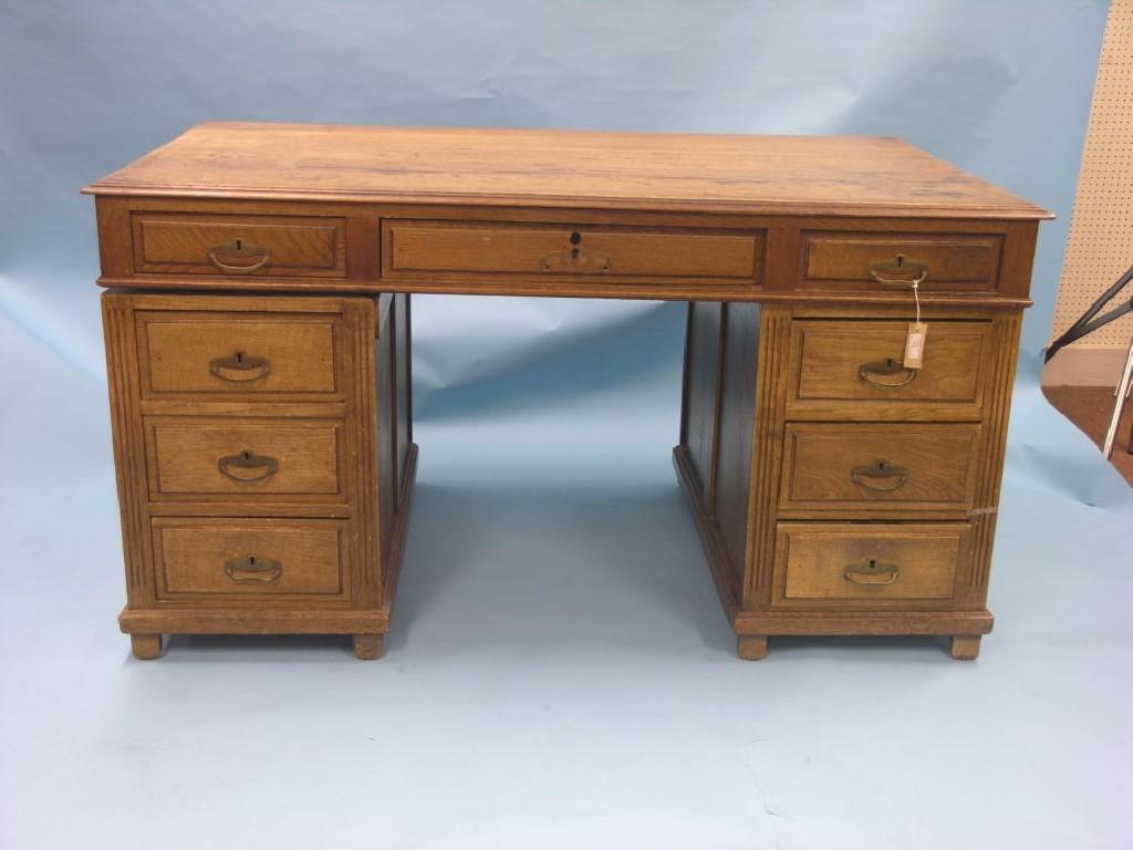 Appraisal: A Victorian oak partner's desk polished top above frieze drawers