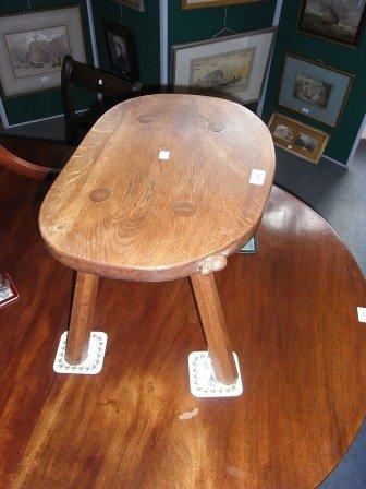 Appraisal: A COLIN 'BEAVERMAN' ALMACK OAK ADZED STOOL