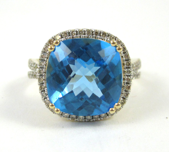 Appraisal: BLUE TOPAZ AND FOURTEEN KARAT GOLD RING The yellow and