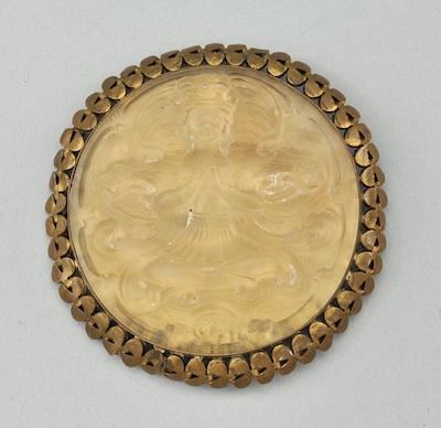 Appraisal: A Glass Medallion in Brass Frame Molded frosted glass medallion