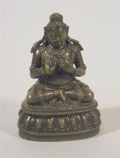 Appraisal: Tibetan bronze figure inscribed verso Seated male deity well incised