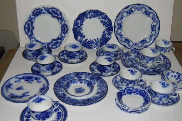 Appraisal: GROUP OF ENGLISH FLOW BLUE POTTERY Plates bowls cups and