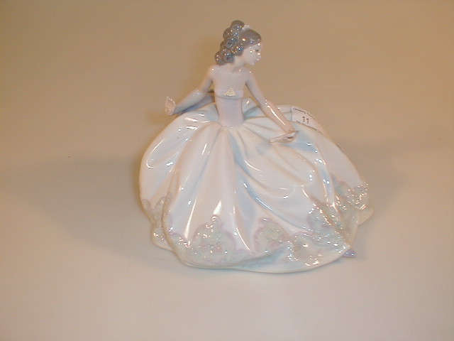 Appraisal: A Lladro porcelain figure of a seated crinoline lady