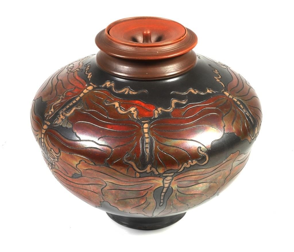 Appraisal: Raku lidded jar with butterfly decoration and metallic glaze by