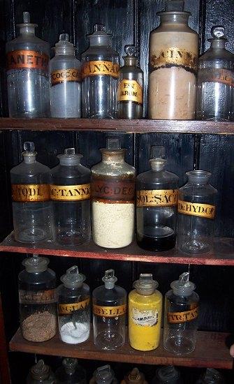 Appraisal: A collection of clear glass drug jars and stoppers with