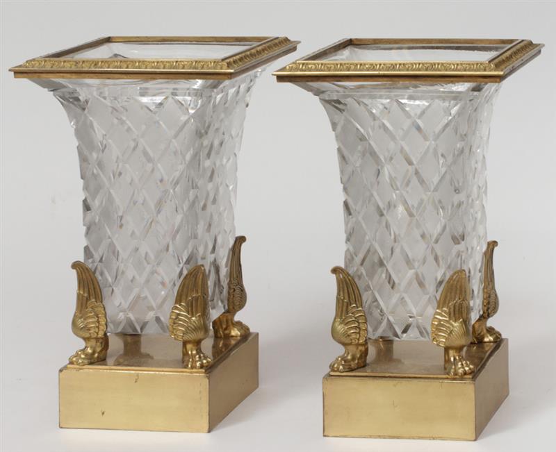 Appraisal: Pair of Empire Style Brass-Mounted Cut-Glass Urns On winged paw