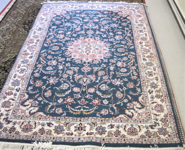 Appraisal: HAND KNOTTED ORIENTAL CARPET Indo-Kashan floral and central floral medallion