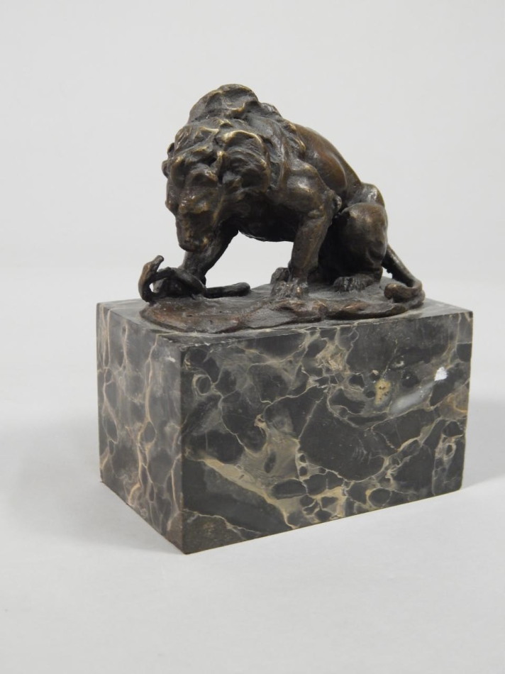 Appraisal: Manner of Barye Bronze figure of a lion and serpent