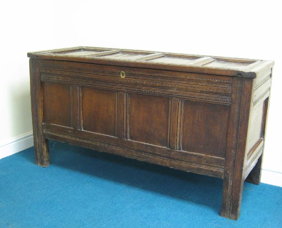 Appraisal: An antique oak Coffer with panelled top and front with