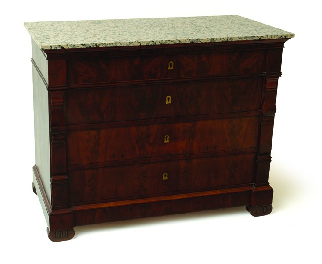 Appraisal: A BIEDERMEIER FLAME MAHOGANY COMMODE The rectangular marble top above