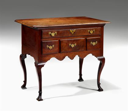 Appraisal: Walnut dressing table pennsylvania th century Rectangular molded top surmounting