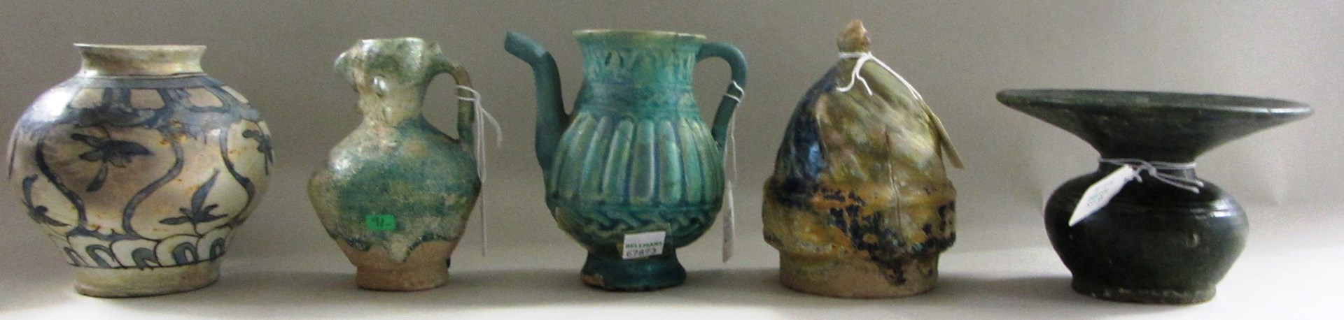 Appraisal: A collection of nine pottery vessels mostly Iran th- th