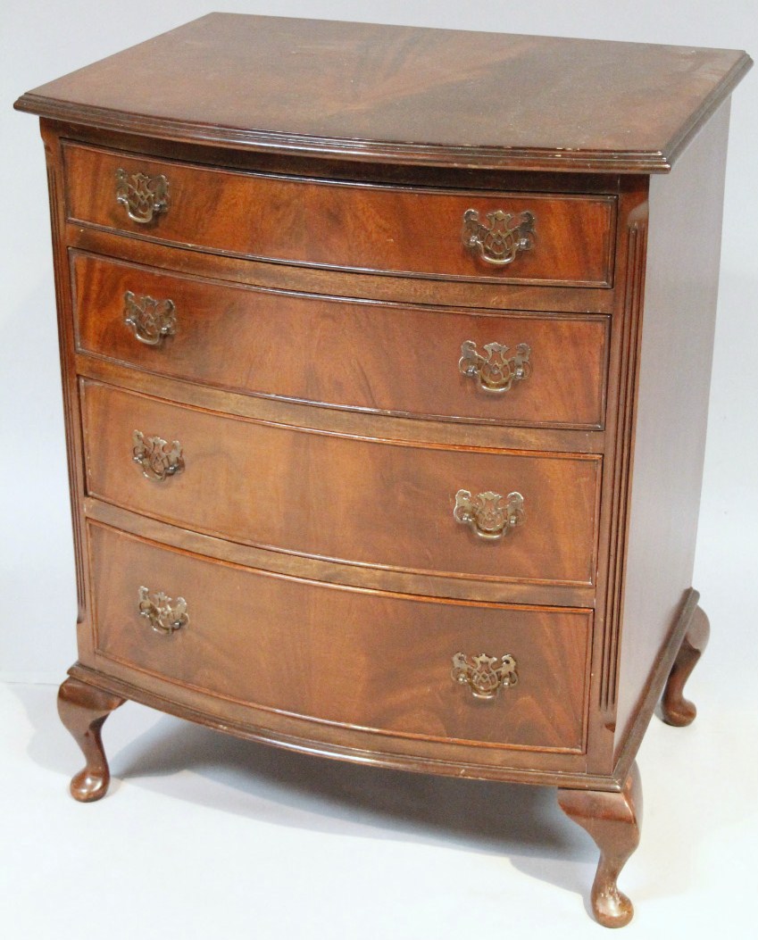 Appraisal: A thC walnut finish bow front chest of four long