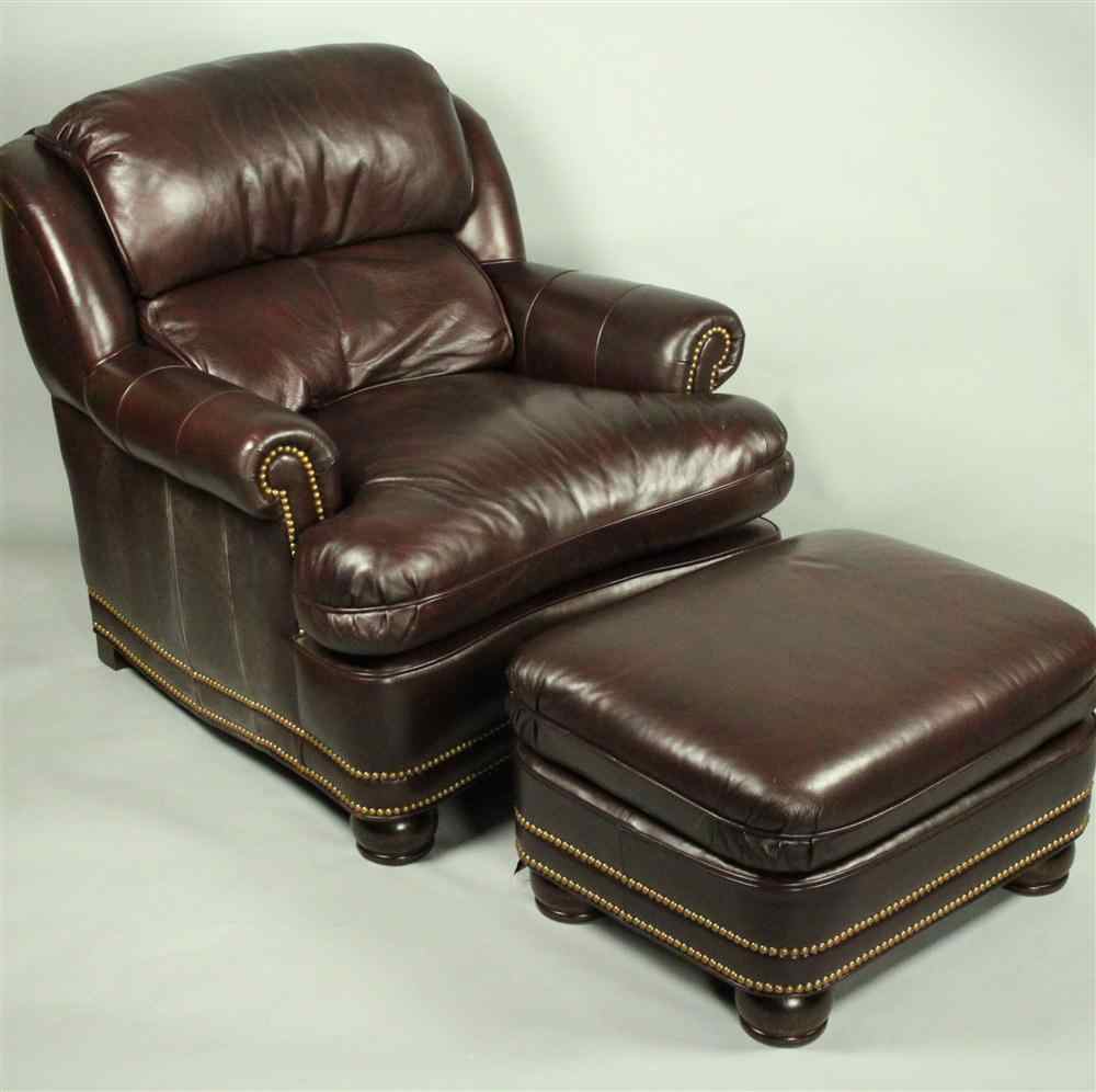 Appraisal: HANCOCK AND MOORE CONTEMPORARY OVERSTUFFED BROWN LEATHER CHAIR WITH OTTOMAN