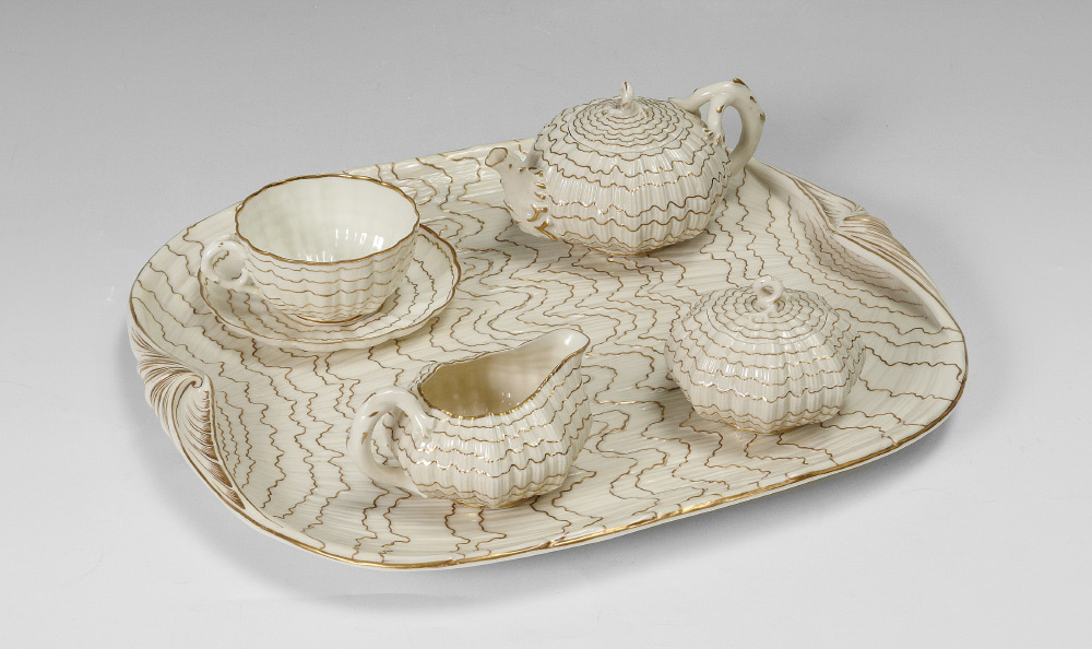 Appraisal: IRISH BELLEEK TRIDACNA TEA SET WITH TRAY Black mark Set