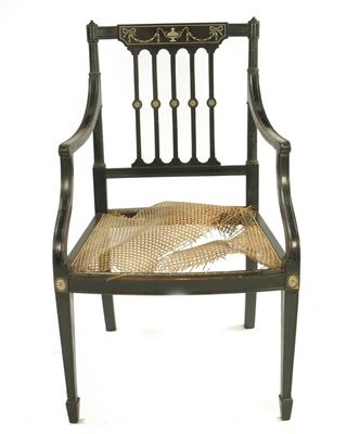 Appraisal: A th century ebonised open armchair the tablet top rail