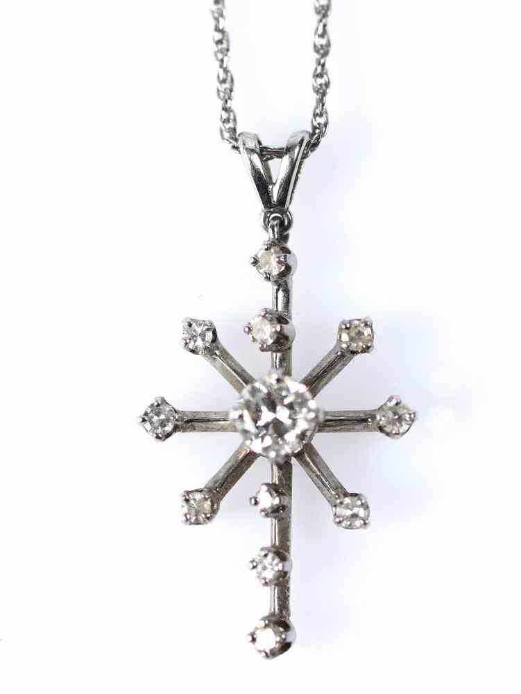 Appraisal: PENDANT - One K white gold and diamond star form