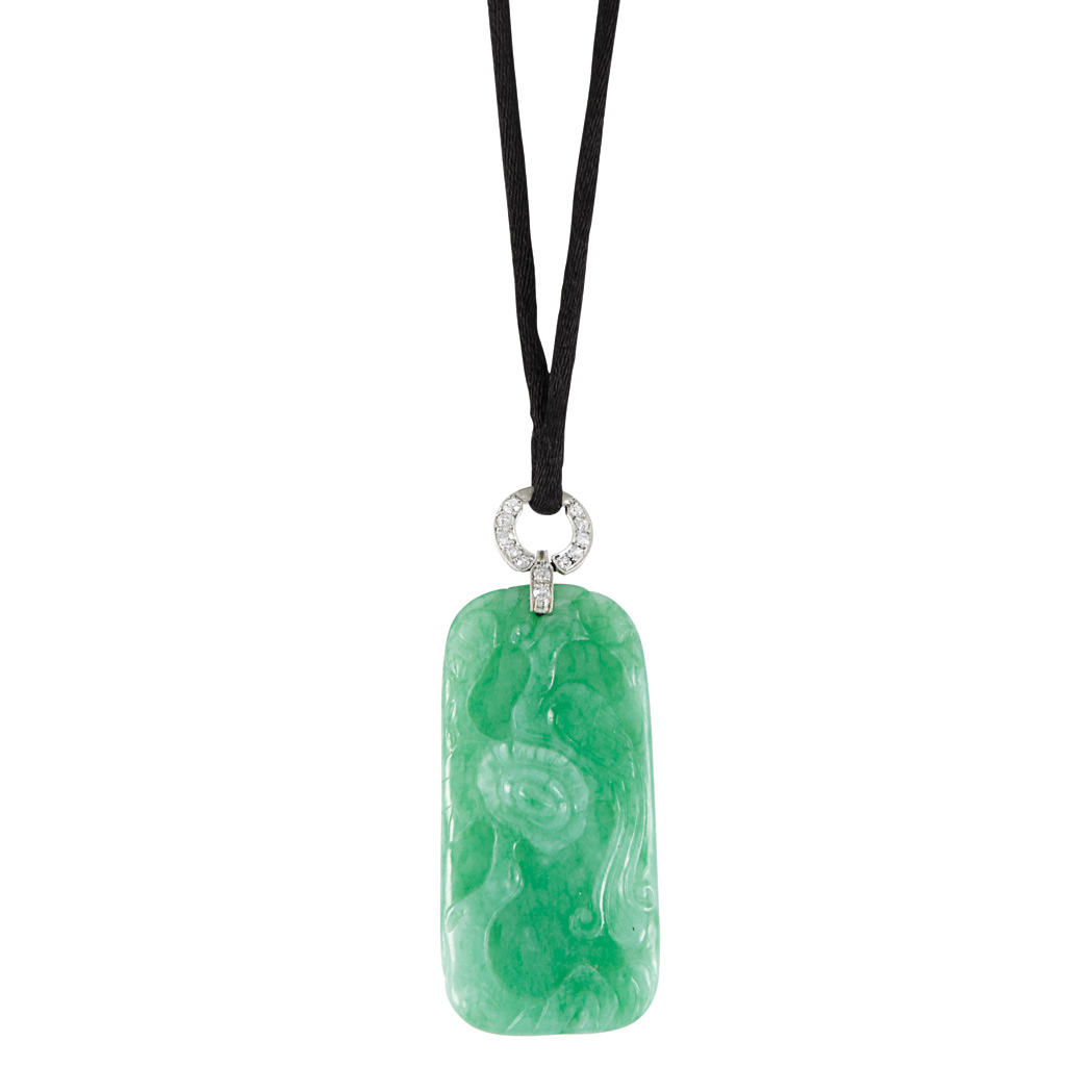 Appraisal: Carved Jade and Diamond Pendant with Cord Necklace One oblong