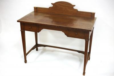 Appraisal: An Edwardian satinwood kneehole dressing table cross banded with shaped