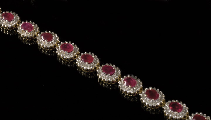 Appraisal: Fourteen-Karat Yellow Gold Ruby and Diamond Bracelet featuring a flexible