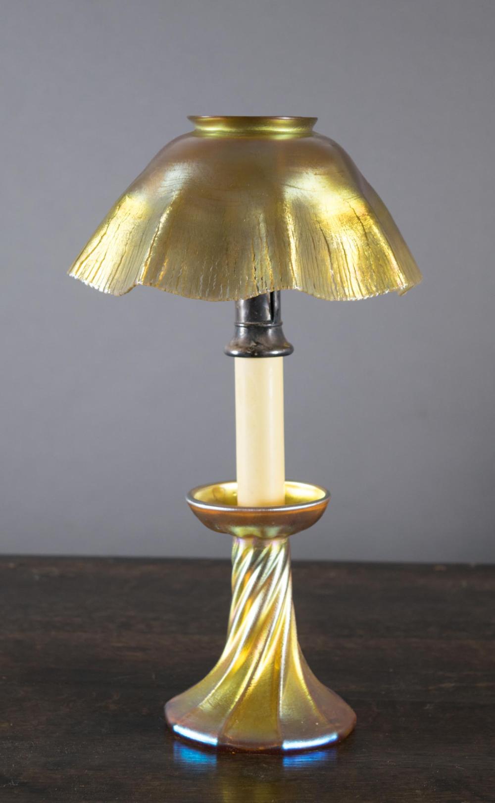 Appraisal: LOUIS COMFORT TIFFANY ART GLASS CANDLE LAMP gold iridescent shade