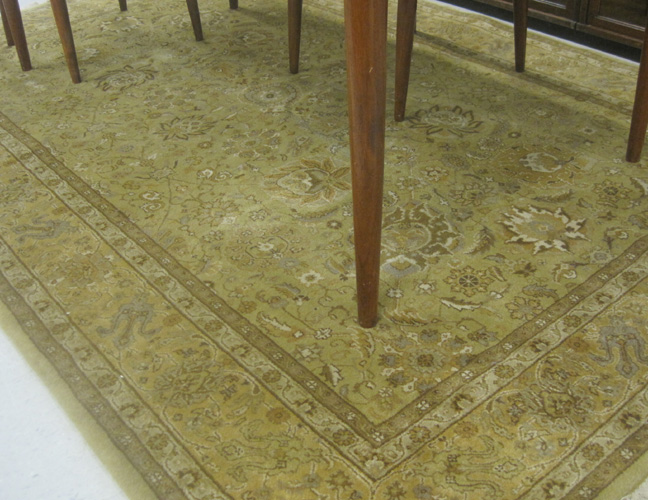 Appraisal: HAND KNOTTED ORIENTAL CARPET Indo-Persian overall floral design on khaki