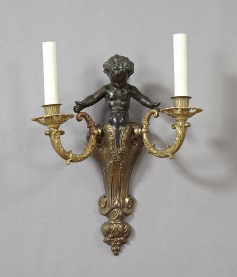 Appraisal: French Parcel-Black-Patinated Brass Two-Light Baby Nereid Applique in the Louis